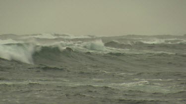 Rough waves breaking against a rocky shore