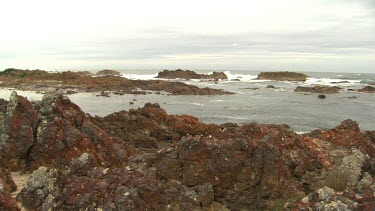 Waves breaking against a rocky shore