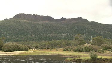 The Walls of Jerusalem -Mountains and shrubs along the edge of a river