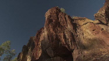 High rocky cliffs against a blue sky