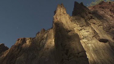 High rocky cliffs against a blue sky