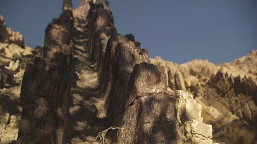 High rocky cliffs against a blue sky