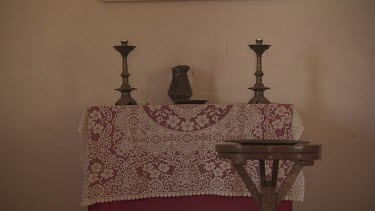 Religious altar and print of Jesus on the cross