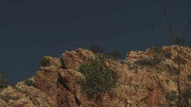 Tall mountain ridge against a blue sky
