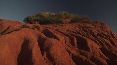 Close up of a red rocky dune on a beach