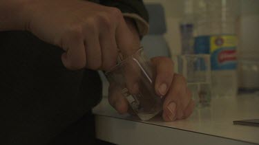 Mixing medicine in a glass measuring cylinder