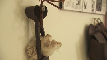 Sheep fleece hanging from rusty equipment