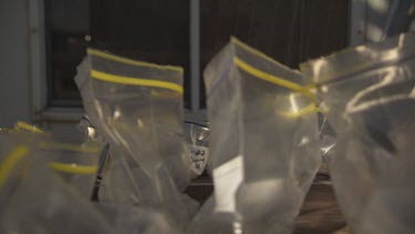 Injecting a syringe into plastic specimen bags