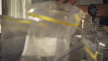 Injecting a syringe into plastic specimen bags