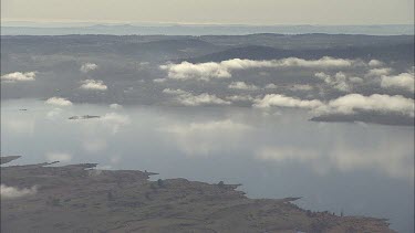 Clouds over a scenic mountain lake