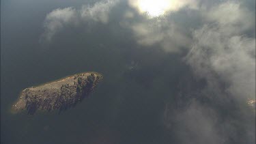 Clouds over a scenic mountain lake