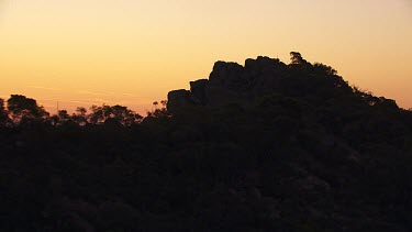 Silhouetted mountain peaks in the Flinder Ranges at sunset