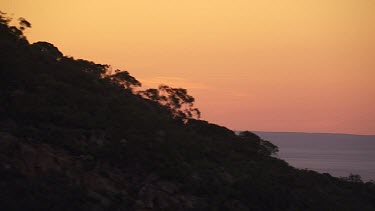 Silhouetted mountain peaks in the Flinder Ranges at sunset