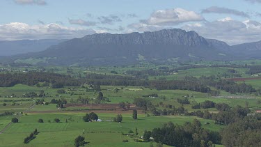 Lush farmland and Cradle Mountain