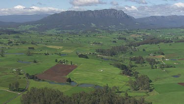 Lush farmland and Cradle Mountain