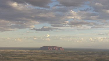 Red rocky cliff at dusk in Uluru-Kata Tjuta National Park