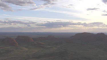 Red rocky cliff at dusk in Uluru-Kata Tjuta National Park