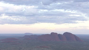 Red rocky cliff at dusk in Uluru-Kata Tjuta National Park