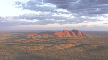 Red rocky cliff at dusk in Uluru-Kata Tjuta National Park