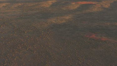 Red rocky cliff at dusk in Uluru-Kata Tjuta National Park