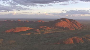 Red rocky cliff at dusk in Uluru-Kata Tjuta National Park