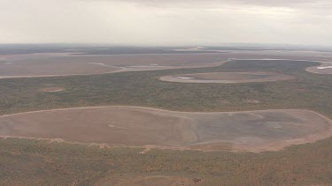 Large pools of water on the outback landscape