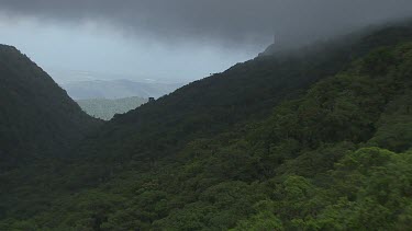 Fog over a forested mountain pass in Daintree National Park