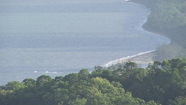 Aerial view of a winding river through a forested landscape