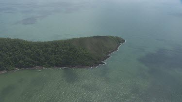 Aerial view of the ocean and a forested coast in Daintree National Park