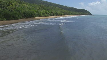 Aerial view of the ocean and a forested coast in Daintree National Park