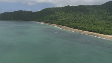 Aerial view of the ocean and a forested coast in Daintree National Park