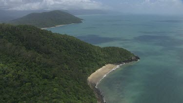 Aerial view of the ocean and a forested coast in Daintree National Park