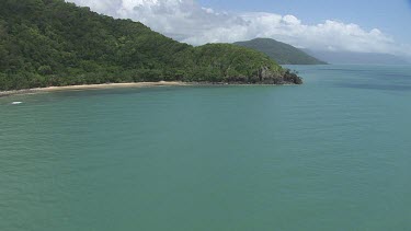 Aerial view of the ocean and a forested coast in Daintree National Park