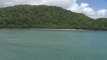 Aerial view of the ocean and a forested coast in Daintree National Park