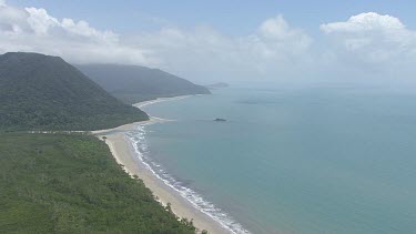 Aerial view of the ocean and a forested coast in Daintree National Park