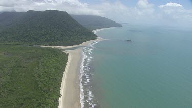 Aerial view of the ocean and a forested coast in Daintree National Park