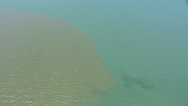 Sand bar and clear blue water in Daintree National Park