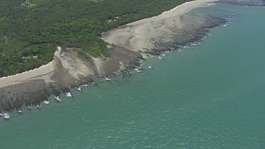 Aerial view of the ocean and a forested coast in Daintree National Park