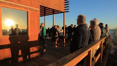 Tourists watching for dolphins at Monkey Mia Shore