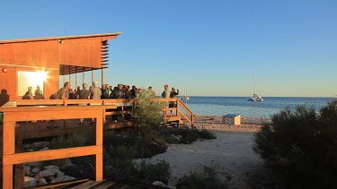 Tourists watching for dolphins at Monkey Mia Shore