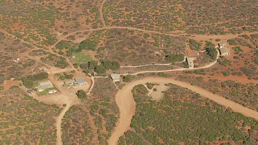 Aerial View of rugged landscape with modern buildings