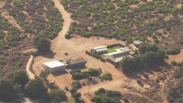 Aerial View of rugged landscape with modern buildings