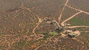 Aerial View of rugged landscape with modern buildings