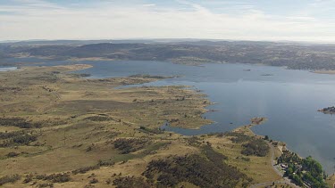 Aerial of Kosciuszko National Park - Boat driving along the river landscape