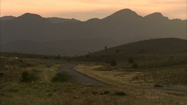 Vehicle on dusty country road