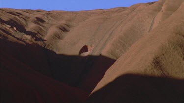 dramatic shadow cast across Uluru