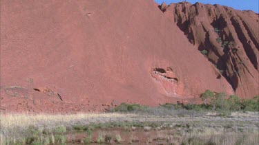 pan across Uluru pan across texture small hair in gate at top