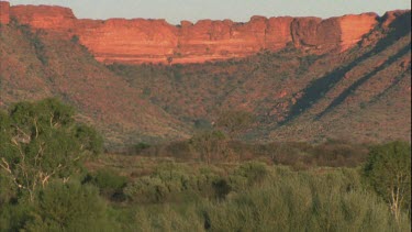 wide establishing shot of Canyon from a distance with flat landscape in foreground