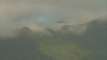 mist , cloud covered mountain top