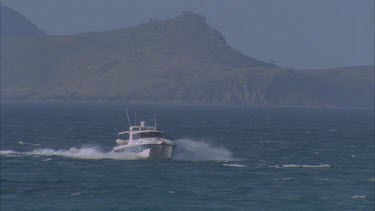 national parks boat coming toward camera marine park rangers and island behind